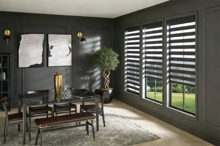 Stylish dining room featuring a marble black table, brown chairs, abstract art on dark walls, and large windows with striped blinds.