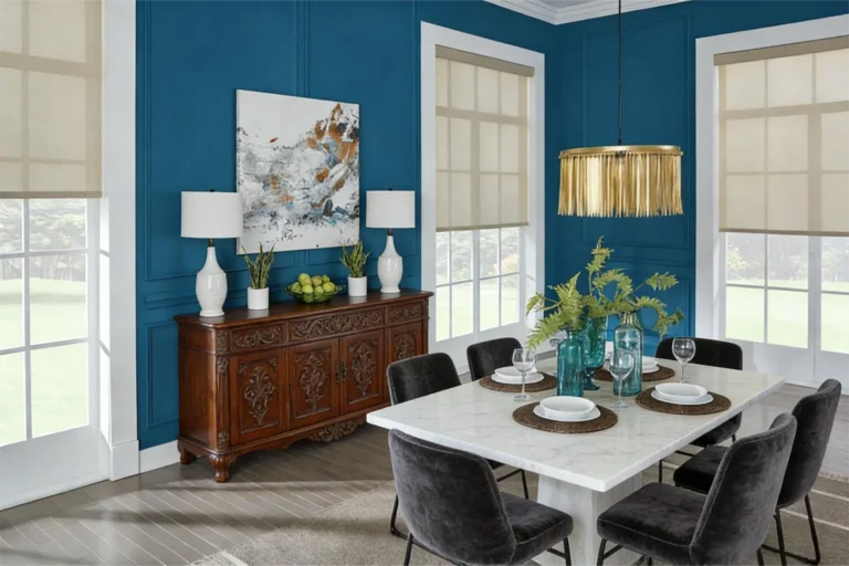 Dining room featuring dark blue walls, a white marble table with place settings, decorative plants, and a sideboard with lamps and artwork.