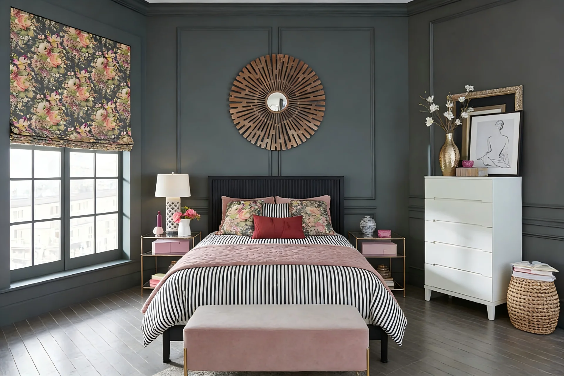 Stylish bedroom with dark walls, floral curtains and pillows, striped bedding, and a central decorative mirror.