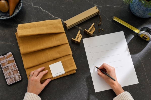 Homeowner documenting a mustard custom shade sample approval with photos and a checklist